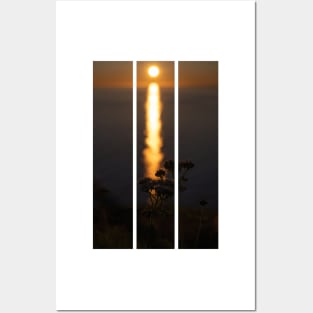 Wonderful landscapes in Norway. Nord-Norge. Beautiful scenery of a midnight sun sunset at Nordkapp (Cape North). Boat and globe on a cliff. Rippled sea and clear orange sky. (vertical) Posters and Art
